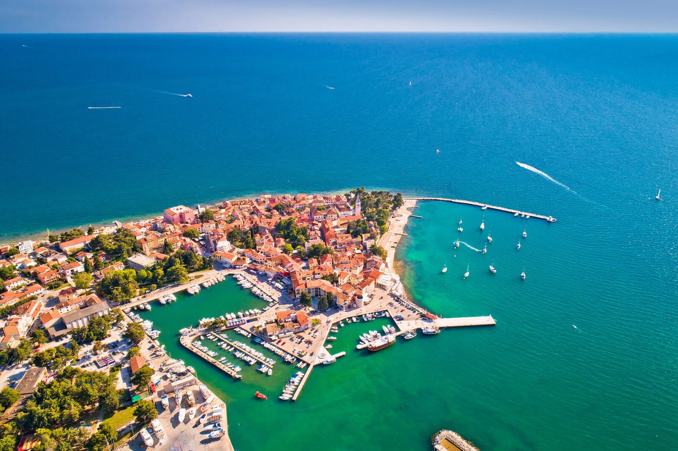 Aerial view of Novigrad’s historic old town and marina on the Istrian coast, ideal for a romantic seaside retreat in Croatia