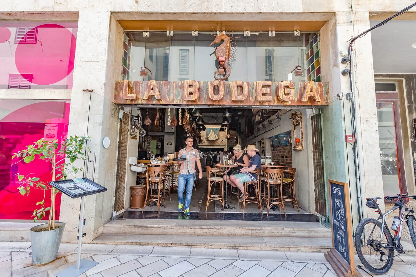 Tourists sitting at a café in Zadar, Croatia